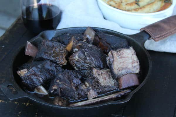 wine braised short ribs in a cast iron pan