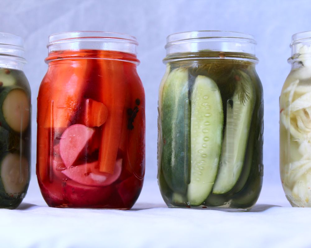 quick pickled cucumber, carrots, fennel, and radish in mason jars