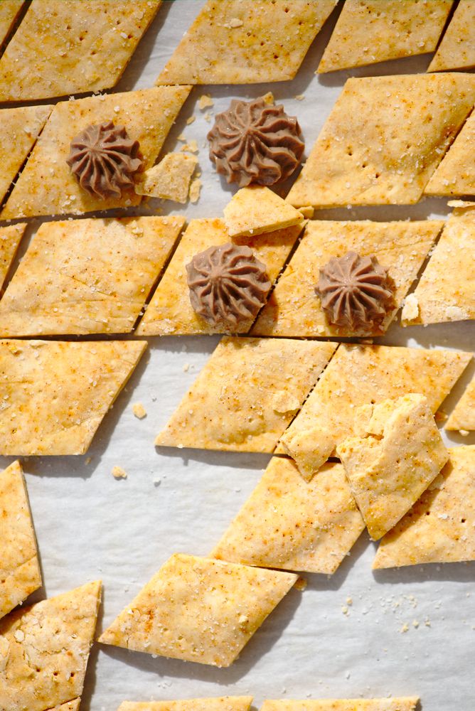 chicken liver mousse piped onto crackers