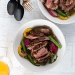 duck breast over summer vegetables in green onion broth
