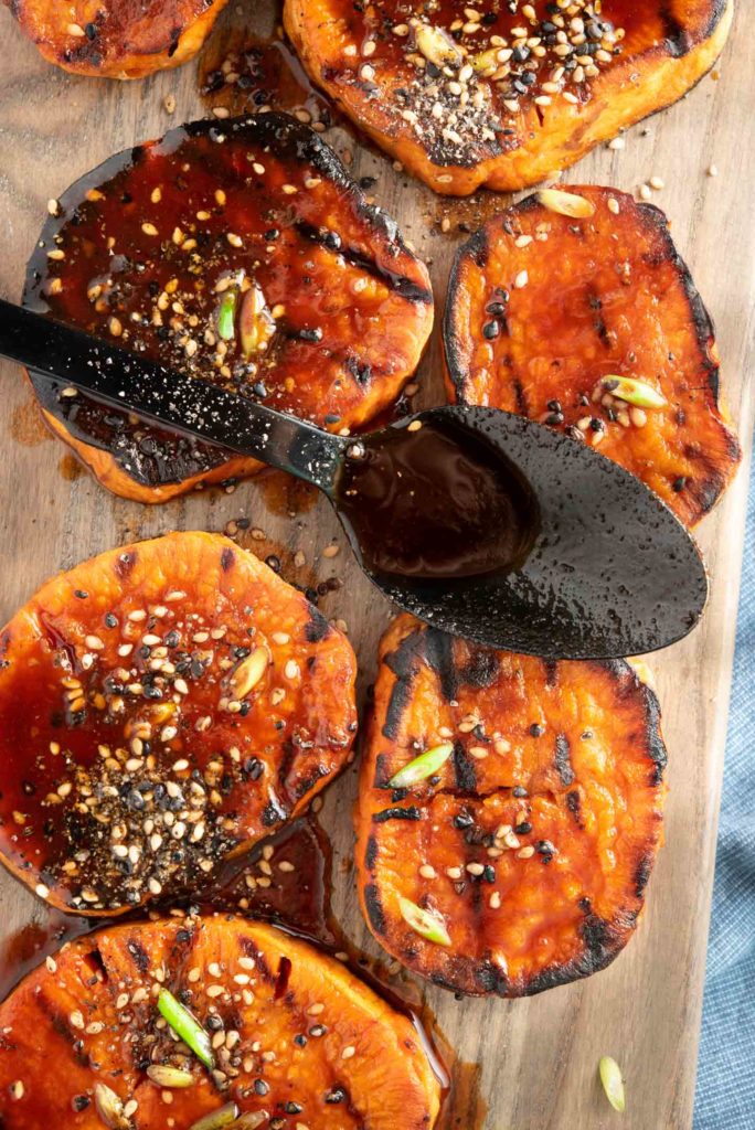 yams sliced and served with chili glaze on a tray