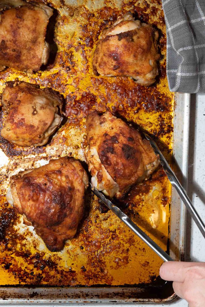 chicken thighs roasted on a sheet pan 