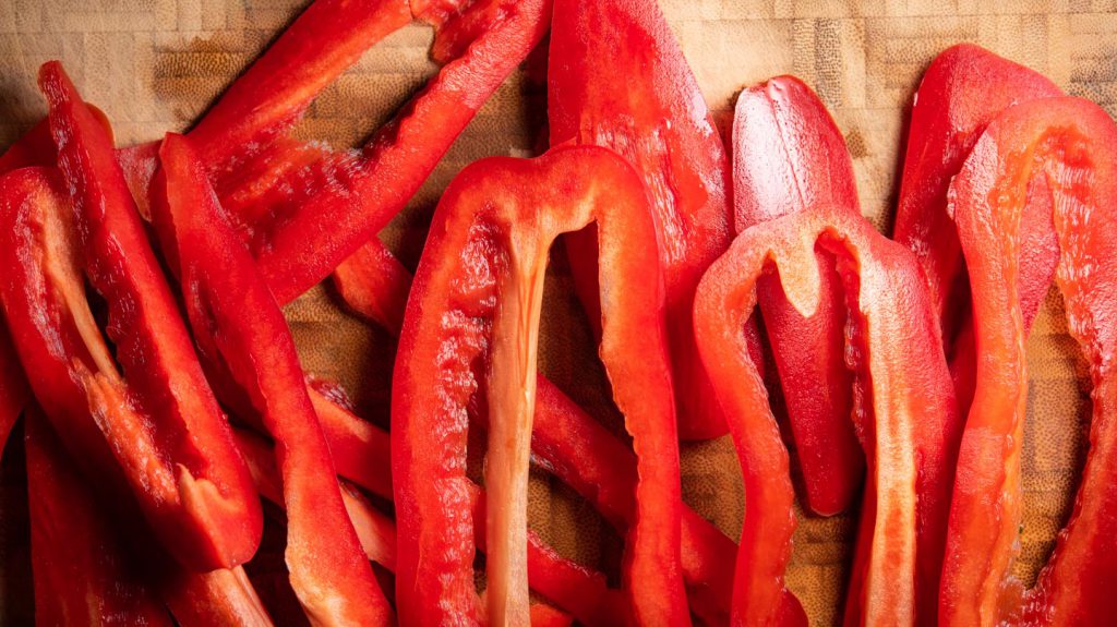 red bell pepper on cutting board