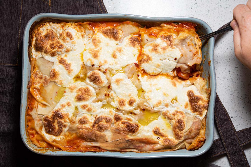 baked vegetable lasagne in casserole dish