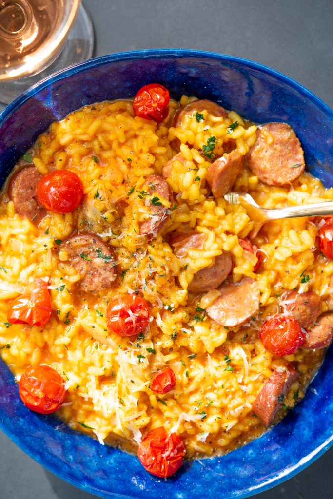 saffron tomato risotto with fresh herbs, andouille sausage, and clams