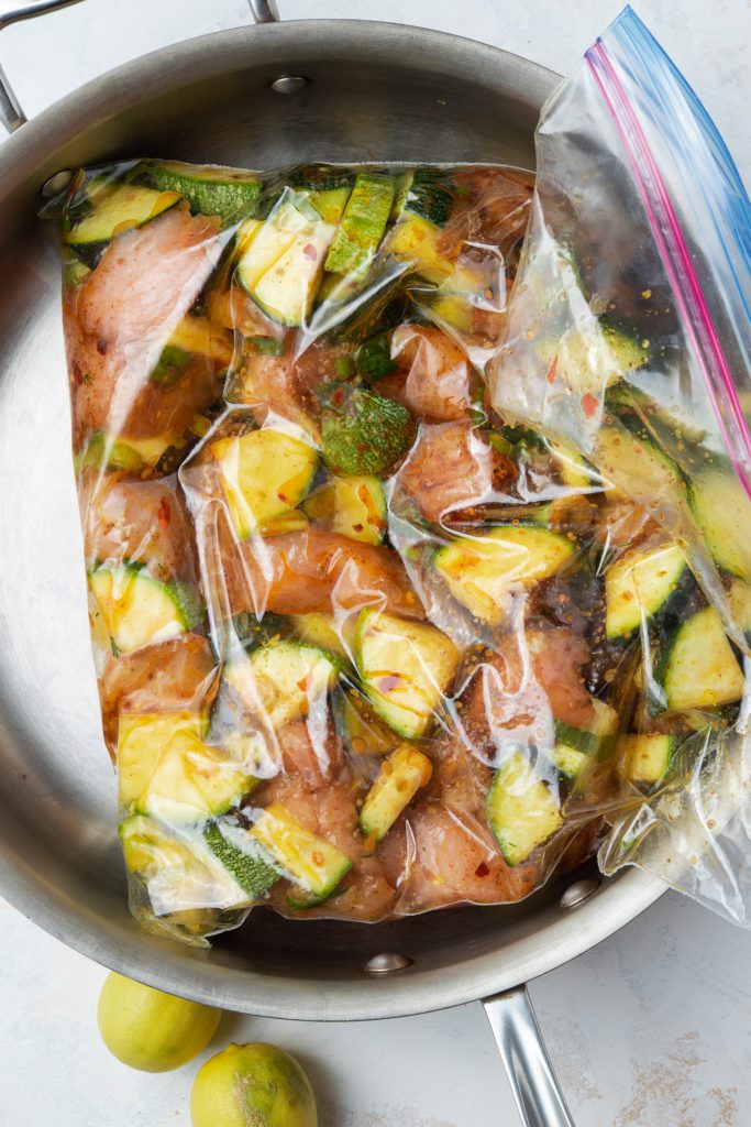 chicken and zucchini marinating in a bag