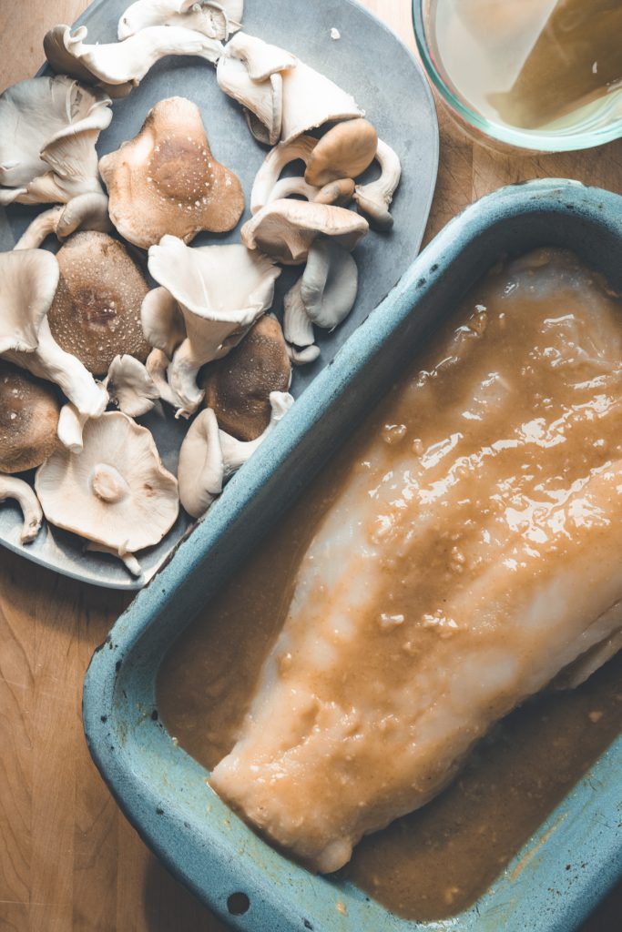 oyster and shiitake mushrooms on a roasting tray, miso marinade on cod, kombu soaking in water