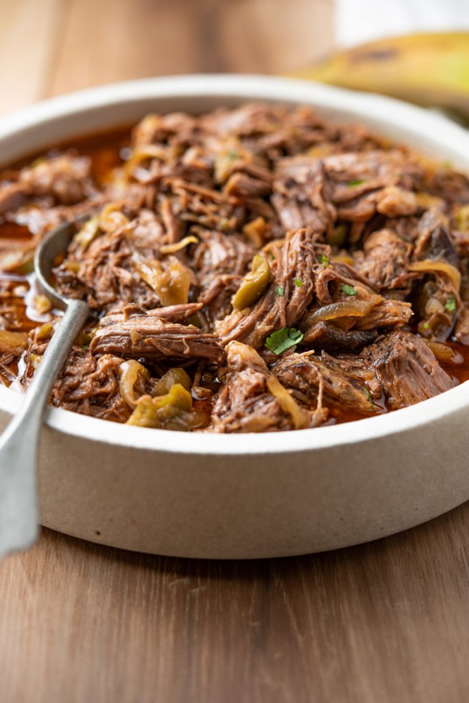 ropa vieja - cuban shredded beef with olives in tomato broth