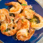 garlic shrimp roased on sheet tray with fresh herbs and chili and lime
