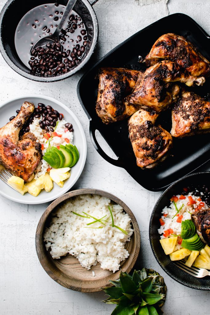 baked chicken quarters with jamaican jerk sauce, rice, and beans